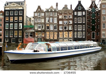 stock-photo-amsterdam-canal-with-with-sightseeing-tourism-boat-1736455