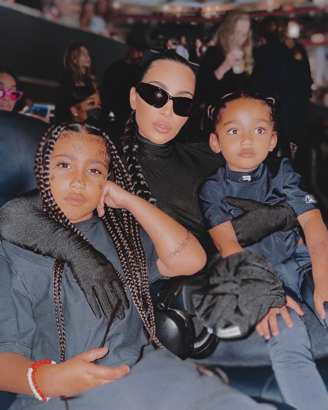 Photo by Kim Kardashian West on August 09, 2021. May be an image of 3 people, child, people sitting and sunglasses.