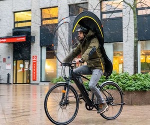 walking bicycle bub up rainy city street road