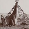 A Cheyenne Woman and Child Raising a Tipi.
