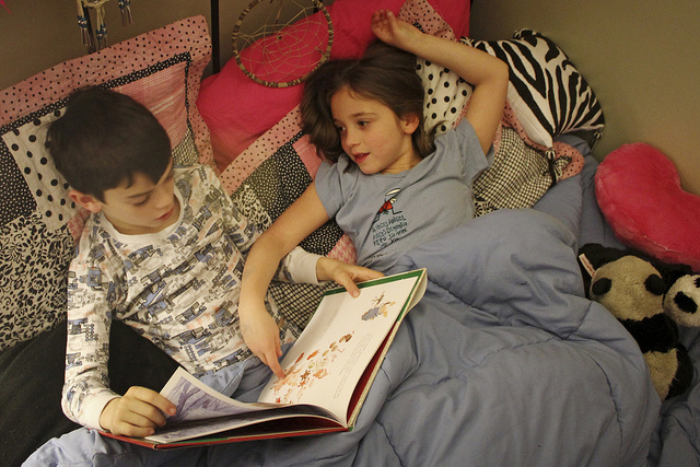 slumber party, with a book