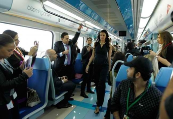 A-model-presents-a-creation-during-the-Express-Fashion-catwalk-show-onboard-the-Dubai-Metro-on-Janua