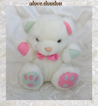 Doudou Peluche Ours Blanc Assis JLS Rose Vert Noeud