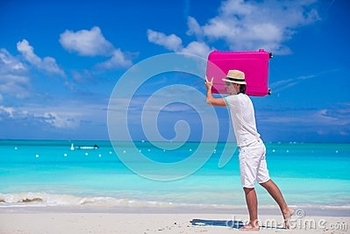 young-man-walking-his-bag-tropical-white-beach-40178369