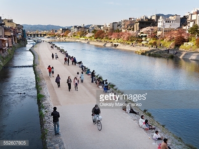 rainbow japan people walking along river 