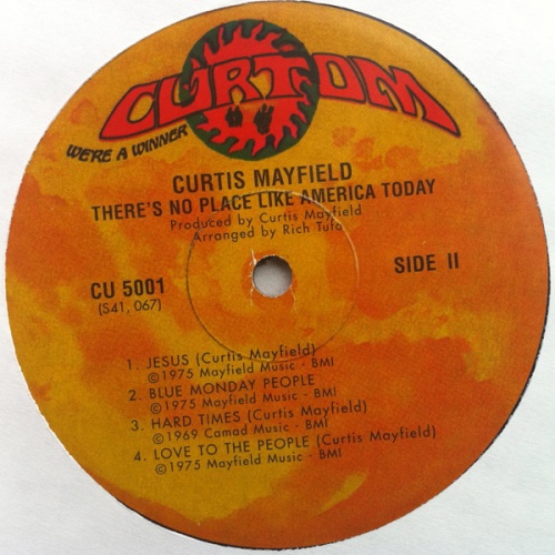 1975 : Album " There's No Place Like America Today " Curtom Records CU 5001 [ US ]