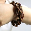 Bracelet papillon marron avec des gros perles à facettes 50€