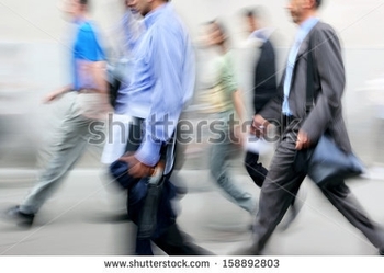 stock-photo-business-people-at-rush-hour-walking-in-the-street-in-the-style-of-motion-blur-158892803
