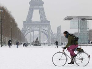 walking bicycle snowtorm winter  