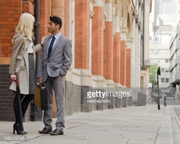 155015745-business-people-flirting-gettyimages