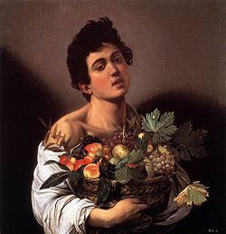 garçon avec un panier de fruits