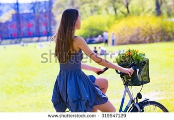 stock-photo-young-woman-with-retro-bicycle-in-a-park-outdoor-portrait-toned-photo-soft-focus-3195471