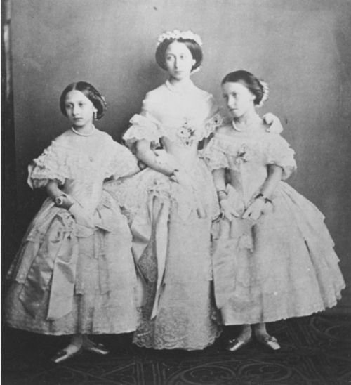 Tea Time at Winter Palace: Princess Louise, Princess Alice & Princess Helena of England in the dresses they wore at the marriage of their eldest sister Princess Victoria to Frederich III, January 25 1858.: