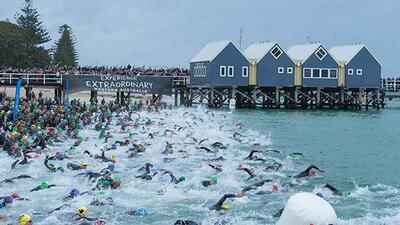 city street ocean swim triathletes water iron man triathlon competition beach 