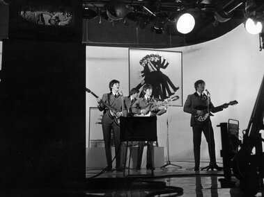 The Beatles perform one of their songs while filming A Hard Day's Night in 1964.