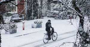 walking bicycle snowy winter city 