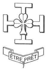 Dessin d'une croix de Jérusalem portant un trèfle à trois feuilles en son centre. Au-dessous dans un bandeau la mention ETRE PRET
