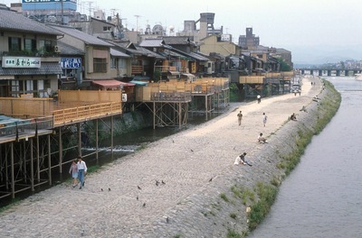rainbow japan people walking along river 