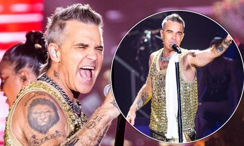 Robbie Williams puts on dazzling display in sequinned gold vest on his XXV  tour | Daily Mail Online