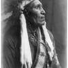 Raven Blanket--Nez Percé wearing many necklaces and war bonnet