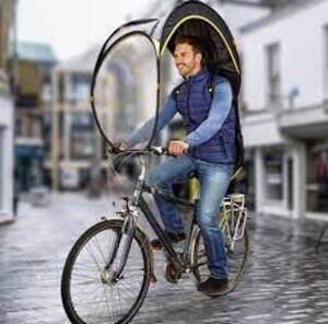 walking bicycle hands umbrella rainy city street road