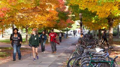 books autumn students walking campus 