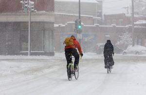 walking bicycle snowtorm winter  