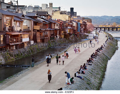 rainbow japan people walking along river 