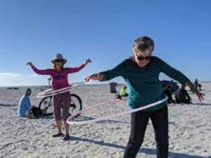 rainbow hula hoop beach sand sea