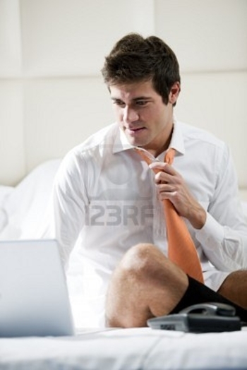 9260318-relaxed-businessman-working-in-hotel-room