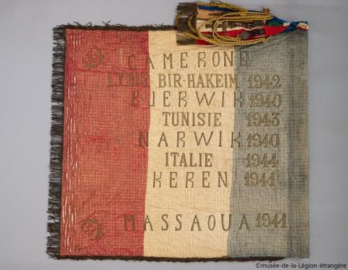 * Le premier Drapeau de la 13ème Demi-Brigade de la Légion Etrangère (DBLE).