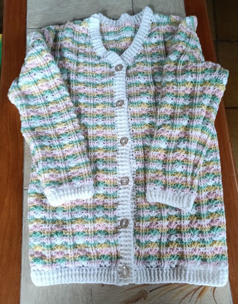 Une veste longue "sucre d'orge" au crochet...